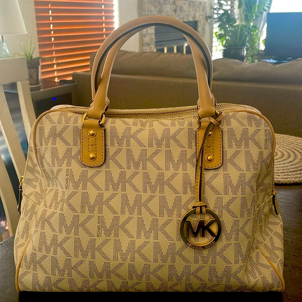 A cream and tan Michael Kors tote.